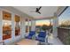 Balcony featuring comfortable seating, ceiling fan and beautiful sunset views at 601 Avenida De Mayo, Sarasota, FL 34242