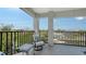 Relaxing balcony with chair, table and view of the surrounding community at 601 Avenida De Mayo, Sarasota, FL 34242