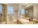 Clean bathroom featuring a granite vanity, ceramic tile floor and walk-in shower at 601 Avenida De Mayo, Sarasota, FL 34242