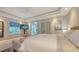 Bright bedroom with a ceiling fan, a palm tree view, and a wall-mounted television at 601 Avenida De Mayo, Sarasota, FL 34242