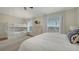 Spacious bedroom featuring a bunk bed, a comfortable bed, a dresser, and bright windows at 601 Avenida De Mayo, Sarasota, FL 34242