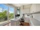 Bright home office with a built-in desk, storage cabinets, and a balcony at 601 Avenida De Mayo, Sarasota, FL 34242