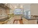 Modern kitchen showcasing granite counters, stainless appliances, white cabinets, and an open floorplan at 601 Avenida De Mayo, Sarasota, FL 34242