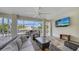 Enjoy outdoor living on this screened lanai with a comfortable seating area and water view at 601 Avenida De Mayo, Sarasota, FL 34242