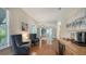 Inviting living area with hardwood floors, comfortable seating, a wet bar, and an open design at 601 Avenida De Mayo, Sarasota, FL 34242