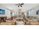 Spacious living area with hardwood floors, comfortable seating, and view of the television at 601 Avenida De Mayo, Sarasota, FL 34242