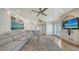 Spacious living room with tile floors, comfortable seating, and stylish decor provides a relaxing atmosphere at 601 Avenida De Mayo, Sarasota, FL 34242