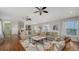 Bright, open living area featuring hardwood floors, ceiling fans and comfortable seating at 601 Avenida De Mayo, Sarasota, FL 34242