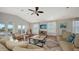 Open living space with vaulted ceilings, balcony access, and comfortable seating at 601 Avenida De Mayo, Sarasota, FL 34242