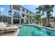 Beautiful outdoor pool with lounge chairs and manicured landscaping at this bright and spacious multi-story home at 601 Avenida De Mayo, Sarasota, FL 34242