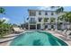 Beautiful outdoor pool with lounge chairs and manicured landscaping at this bright and spacious multi-story home at 601 Avenida De Mayo, Sarasota, FL 34242