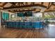 Outdoor bar featuring TVs, a scenic lake view, and a lively atmosphere for socializing at 7015 Stanhope Pl, University Park, FL 34201