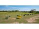 Expansive driving range featuring distance markers and lush greenery under a clear sky at 7015 Stanhope Pl, University Park, FL 34201