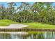 Golf course with lush greenery and beautiful water view at 7015 Stanhope Pl, University Park, FL 34201