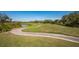 Well-manicured golf course with winding path, offering a scenic and challenging play at 7015 Stanhope Pl, University Park, FL 34201