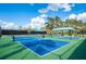 Well-maintained green and blue pickleball courts with a shaded player rest area at 7015 Stanhope Pl, University Park, FL 34201