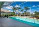 Gorgeous screened pool and patio area with inviting seating at 7015 Stanhope Pl, University Park, FL 34201