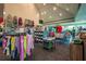 Fully stocked pro shop with clothing racks, displays, and merchandise for golf and tennis at 7015 Stanhope Pl, University Park, FL 34201