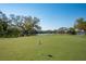 Scenic golf green on the water for residents to practice their short game at 7015 Stanhope Pl, University Park, FL 34201