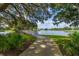 Scenic walking path with bridge offers a peaceful stroll by the water at 7015 Stanhope Pl, University Park, FL 34201