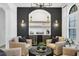Stylish bar area with seating, shelving, lighting, dual wine coolers, and modern decor at 7024 Brier Creek Ct, Lakewood Ranch, FL 34202