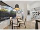 A dining area with a round table, four chairs, and a view of the pool at 7024 Brier Creek Ct, Lakewood Ranch, FL 34202