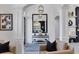 Elegant foyer with a black framed mirror, decor, patterned rug, and an open view of the home at 7024 Brier Creek Ct, Lakewood Ranch, FL 34202