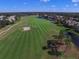 Picturesque view of the golf course and surrounding residential area with winding green and lake at 7024 Brier Creek Ct, Lakewood Ranch, FL 34202