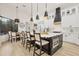 This kitchen features a large island, modern appliances, and pendant lighting at 7024 Brier Creek Ct, Lakewood Ranch, FL 34202