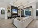Cozy living room with modern décor, fireplace, decorative shelving, and natural light at 7024 Brier Creek Ct, Lakewood Ranch, FL 34202