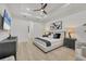 This main bedroom features a king-size bed, two nightstands, and a dresser at 7024 Brier Creek Ct, Lakewood Ranch, FL 34202