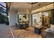 Stylish outdoor patio with cozy seating, fire pit, and seamless access to the indoor living space at 7024 Brier Creek Ct, Lakewood Ranch, FL 34202