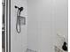 Clean, tiled shower features black hardware and a built-in toiletry niche at 7024 Brier Creek Ct, Lakewood Ranch, FL 34202