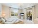 Bright bedroom with large windows, a TV, and a cozy quilted bed at 8043 St Simons St, Bradenton, FL 34201