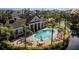 Aerial view of the community pool and pool house in Savannah Preserve, surrounded by lounge chairs at 8043 St Simons St, Bradenton, FL 34201