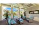Inviting outdoor community space with comfortable seating overlooking the pool and lush landscaping at 8043 St Simons St, Bradenton, FL 34201
