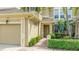 Townhouse exterior featuring a well-manicured landscape and inviting covered entryway at 8043 St Simons St, Bradenton, FL 34201