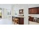 Spacious kitchen featuring modern appliances, granite countertops, and an adjacent dining area at 8043 St Simons St, Bradenton, FL 34201