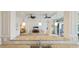 Granite countertop detail with a view of the living room featuring neutral tones and plenty of light at 8043 St Simons St, Bradenton, FL 34201
