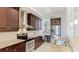 Modern kitchen featuring granite countertops, stainless steel appliances, and dark wood cabinetry at 8043 St Simons St, Bradenton, FL 34201
