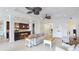 Spacious living room with tile floors, ceiling fans, and a combined kitchen view at 8043 St Simons St, Bradenton, FL 34201
