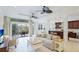 Bright, open living space with tile floors, and a seamless indoor-outdoor flow at 8043 St Simons St, Bradenton, FL 34201