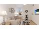 Comfortable living room with a beige sofa, a decorative table lamp, and a television at 8043 St Simons St, Bradenton, FL 34201