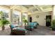 Outdoor lounge space includes comfortable seating, ceiling fans, and views of the community at 8043 St Simons St, Bradenton, FL 34201