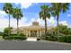 Community clubhouse featuring well-manicured landscaping and inviting entrance at 8294 Barton Farms Blvd, Sarasota, FL 34240