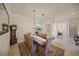Dining room with large table and elegant furnishings at 8294 Barton Farms Blvd, Sarasota, FL 34240
