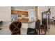 Well-lit kitchen features granite countertops, stainless steel appliances, and wooden cabinetry at 8294 Barton Farms Blvd, Sarasota, FL 34240