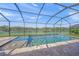 Covered screened pool with lake views and hot tub at 8294 Barton Farms Blvd, Sarasota, FL 34240
