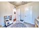 Bright playroom with a round rug, small table and chairs, and a mini-kitchen, creating a fun, play-filled area at 9007 Royal River Cir, Parrish, FL 34219