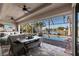 Inviting outdoor patio with seating, bar, and scenic views of the pool and canal at 9332 Miami Cir, Port Charlotte, FL 33981